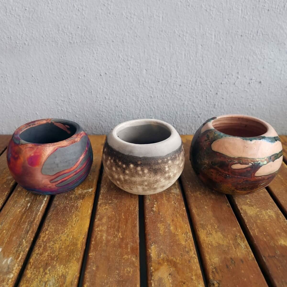 RAAQUU Tsuchi Ceramic Raku Pottery Planter Pot Mixed Finish Set of 3, three spherical rustic pots.